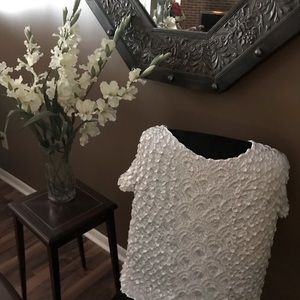 Unique white top graphically appealing to the eye